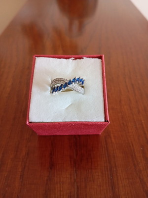 Ring new, gold plated with blue and silver zircon stones, size 7