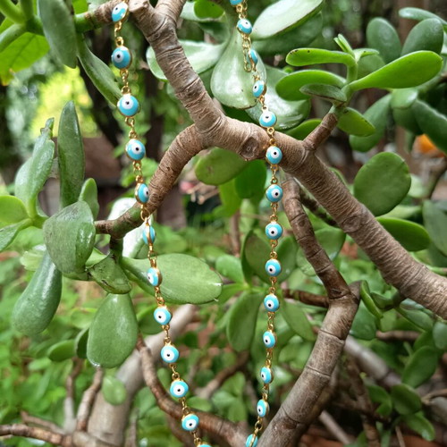 Necklace with blue evil eyes in gold color like new