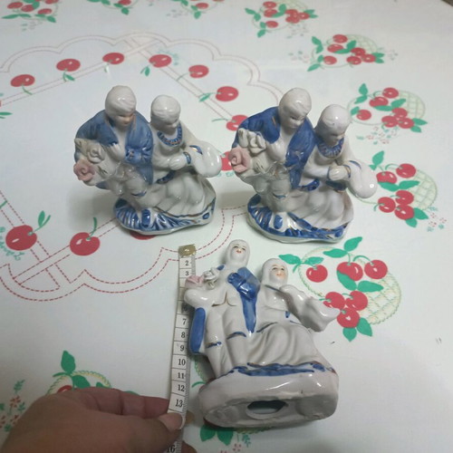 Porcelain figurines like new, pair with pink, blue, and gold flowers