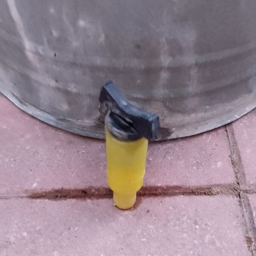 Vintage galvanized water storage with plastic tap used