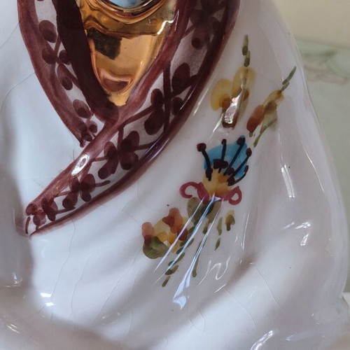 Vintage porcelain Buddha statue with gold details