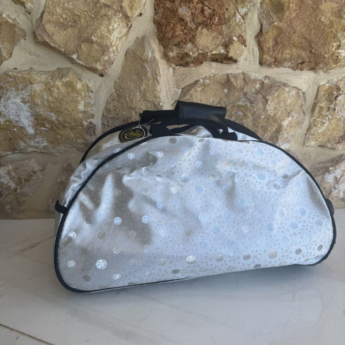Smiley metallic travel bag used with embossed smiley and star designs