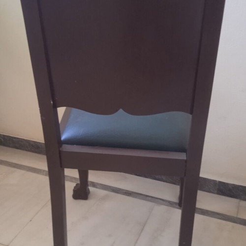 Antique chair used with lion's paw legs needing repair
