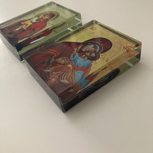 Glass religious icons used, set of two crystal blocks