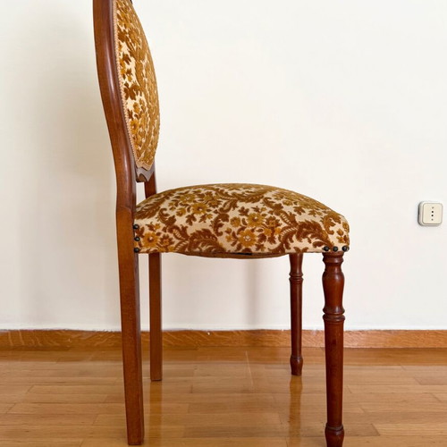 Chair used with wooden frame and brown velour fabric with floral pattern