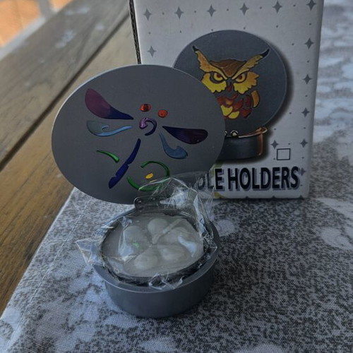 Metal candle holder with stained glass design