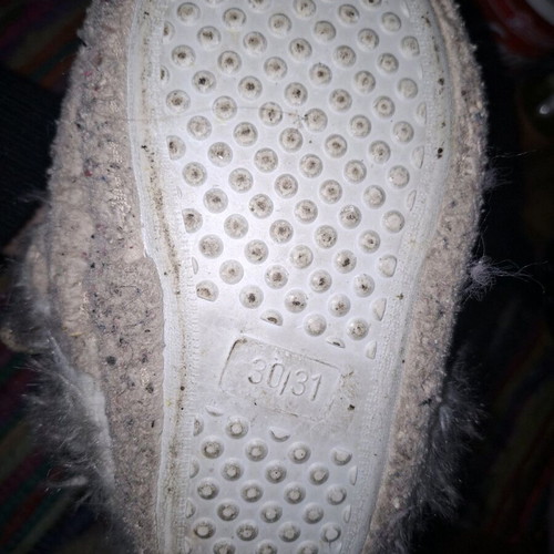 Children's fuzzy reindeer slippers used with glitter details