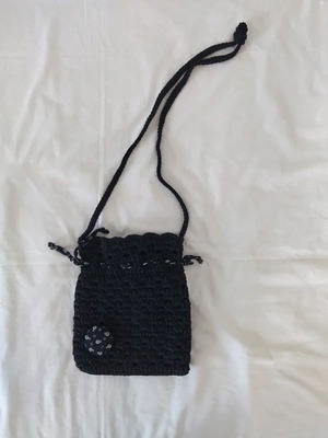 Knitted black shoulder bag like new with floral decoration