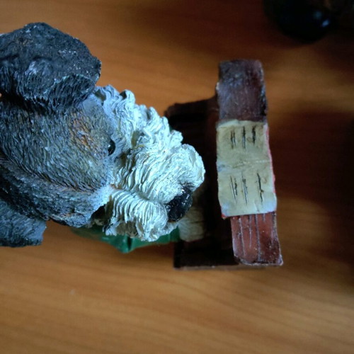 Decorative dog figure with piano like new