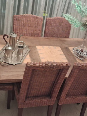 Vintage wooden dining set with rectangular table and six wicker chairs