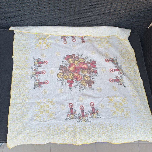 Small tablecloth with candles and fruit used