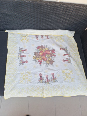 Small tablecloth with candles and fruit used