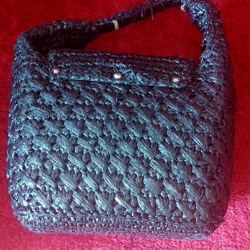 Handmade black raffia handbag used with silver turn-lock clasp