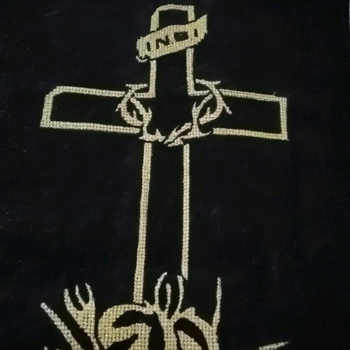 Handmade embroidered cross with gold thread on black velvet canvas