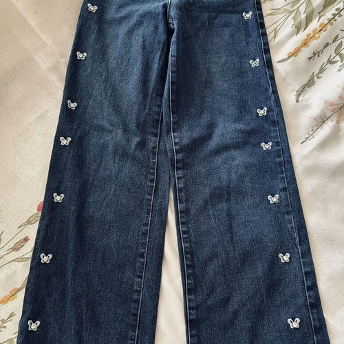 Jeans with butterfly and rhinestone details, size XS, like new
