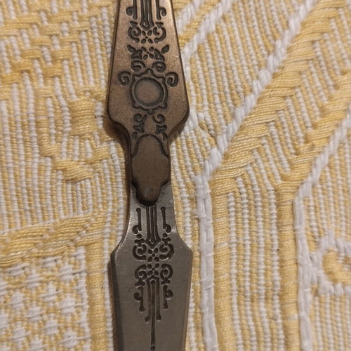 Vintage metal sewing stiletto with Art Nouveau motifs