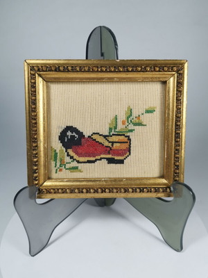 Vintage embroidered frame with traditional tsarouhi used