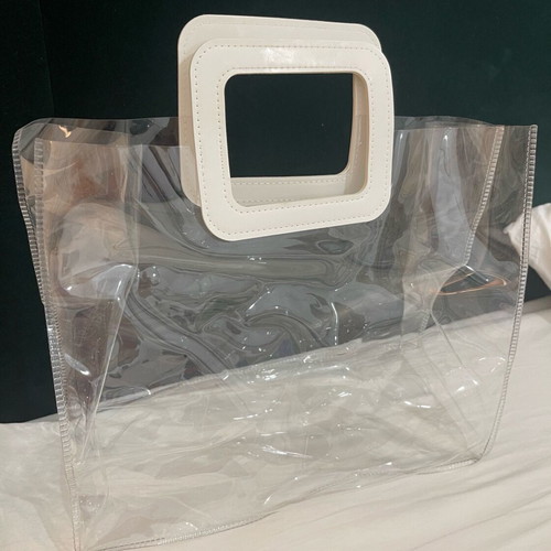 Transparent women handbag like new with white handle