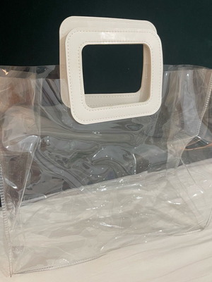 Transparent women handbag like new with white handle