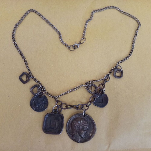 Antique pendant used with ancient Greek symbols