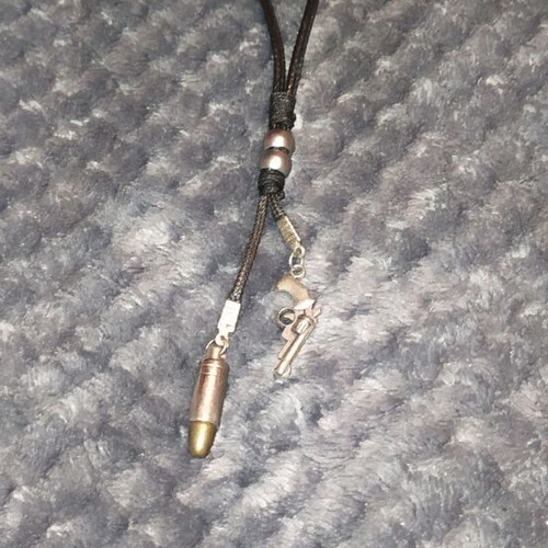 Jewelry pistol and bullet like new, black and silver