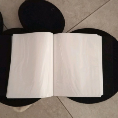Mikey photo album like new, holds 100 photos
