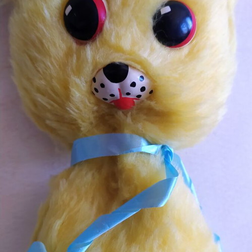 Vintage Greek plush toy, yellow with blue ribbon