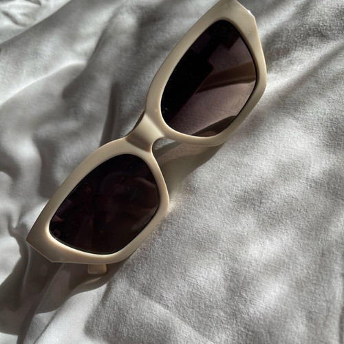 Sunglasses new, beige with metal decoration
