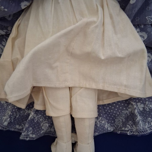 Vintage Slavic doll with porcelain head and fabric body