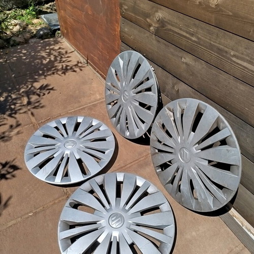 Suzuki Swift hubcaps used, set of 4 for 15 inch rims