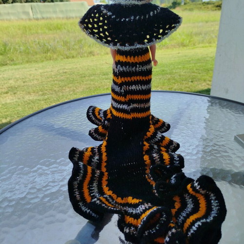 70s doll with handmade knitted clothes and metal stand