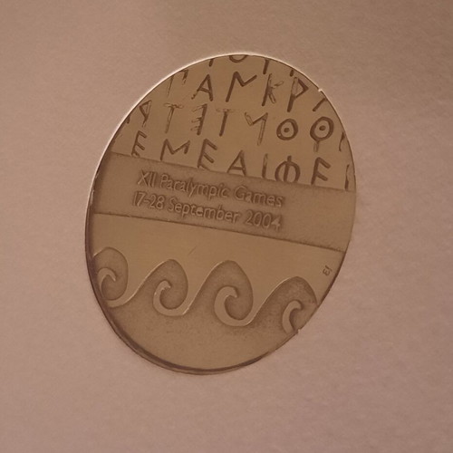 Medal in folder from Athens 2004 Paralympic Games like new
