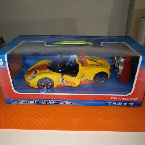 Ferrari yellow with remote control and opening doors new