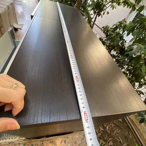Wooden shelf unit used with adjustable shelves, dark finish
