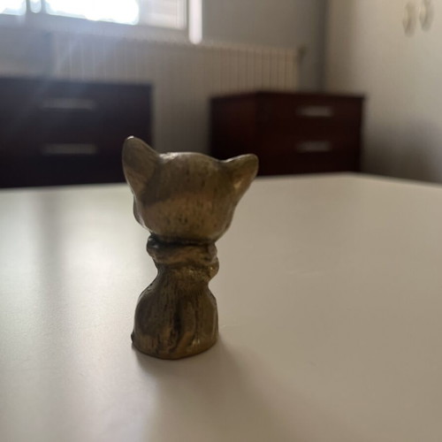 Vintage brass cat figurine with blue glass eyes like new