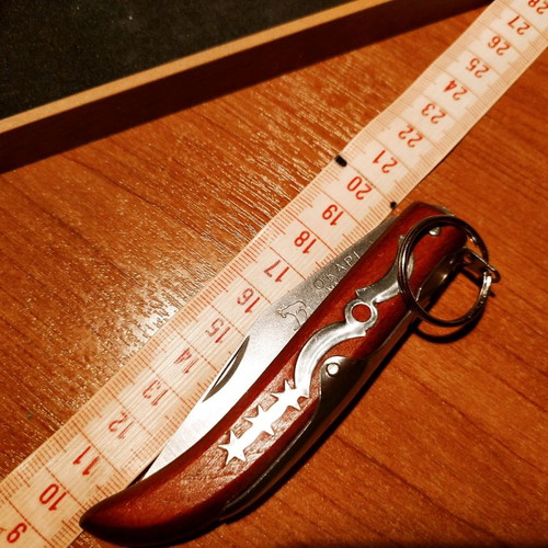 Collectible Zippo lighter 32 years old and handmade Okapi knife.