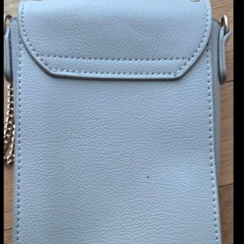 Small blue crossbody bag with chain and studs