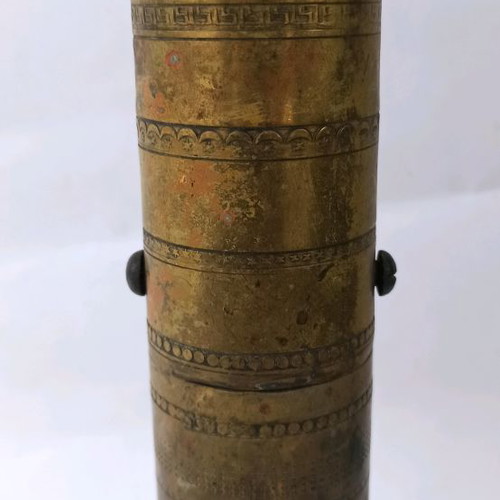 Brass prewar coffee grinder with engraved designs