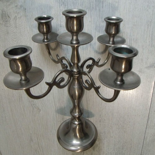 Old metal candlestick with five holders used