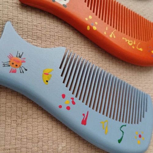 Wooden combs with handmade painted designs