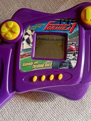 Formula-1 Game handheld console for kids used, with 2 AA batteries