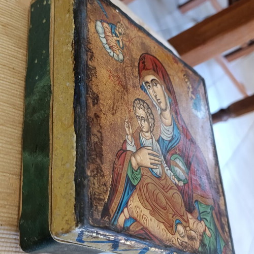 Cardboard box with silk-screened religious icon on canvas