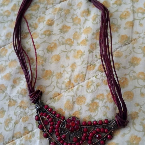 Necklace and earrings used with red stones
