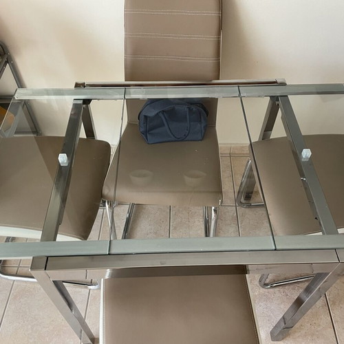 Glass dining table with 4 chairs used, extendable, beige leatherette