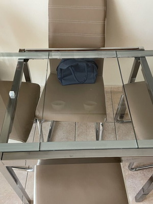 Glass dining table with 4 chairs used, extendable, beige leatherette