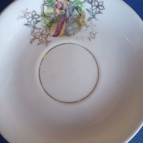Porcelain vintage plates used, set of two with gold details