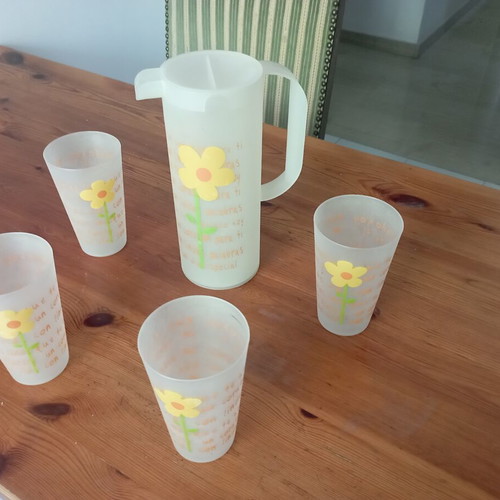 Plastic water jug with four glasses set used