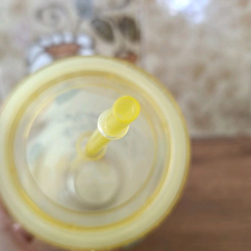 Plastic water bottle new with straw, yellow design