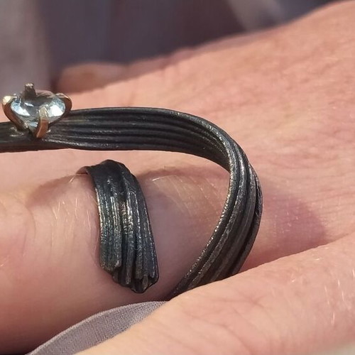 Handmade ring of oxidized silver with white topaz like new