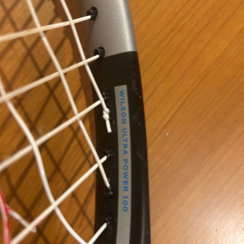 Wilson Ultra Power 100 tennis racket used with 2 broken strings